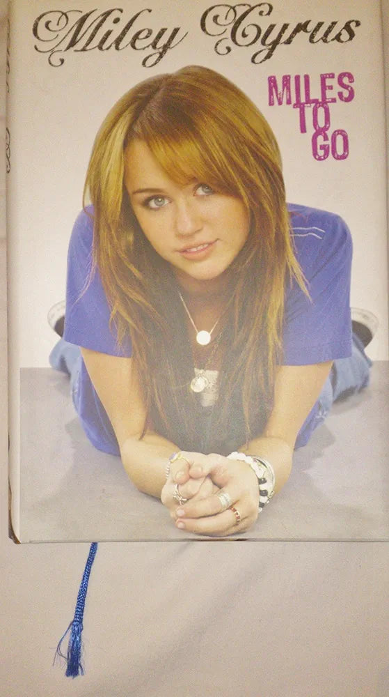 Miley Cyrus Miley Cyrus: Miles to Go(Grade:B)